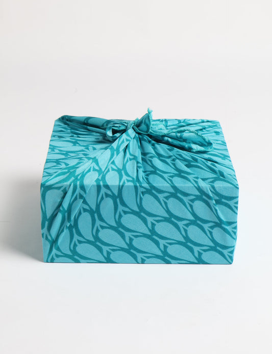 A delicately handcrafted wrap made from recycled sari offcuts, blending sustainable fashion with conscious design. This eco-friendly product showcases the beauty of upcycling and green fashion, making it a perfect accessory for those supporting circular fashion and products made from textile waste.