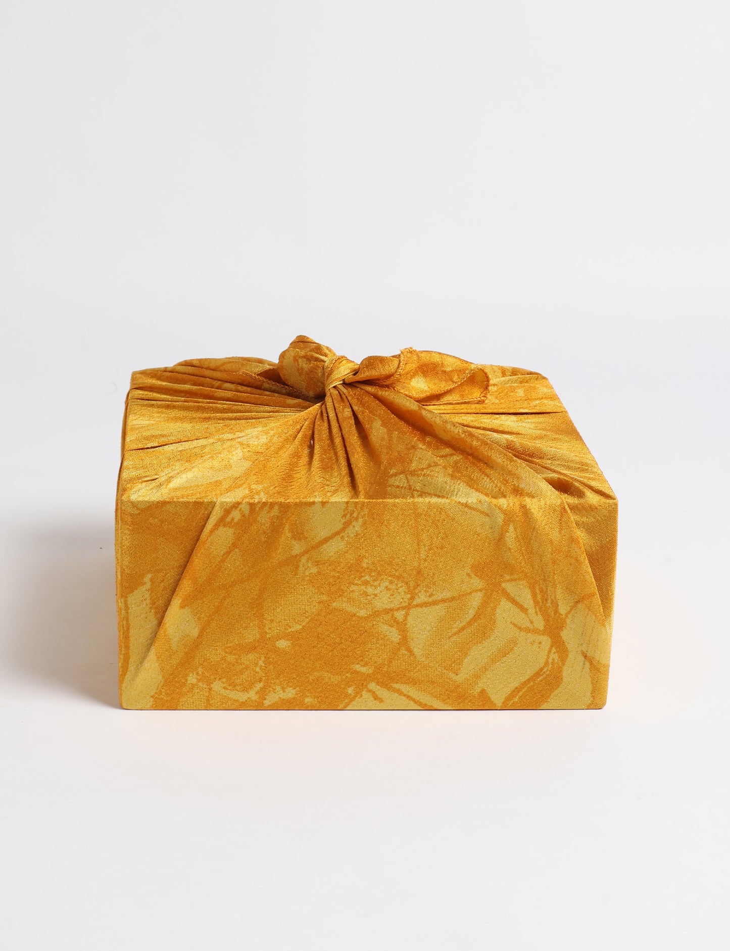 A delicately handcrafted wrap made from recycled sari offcuts, blending sustainable fashion with conscious design. This eco-friendly product showcases the beauty of upcycling and green fashion, making it a perfect accessory for those supporting circular fashion and products made from textile waste.