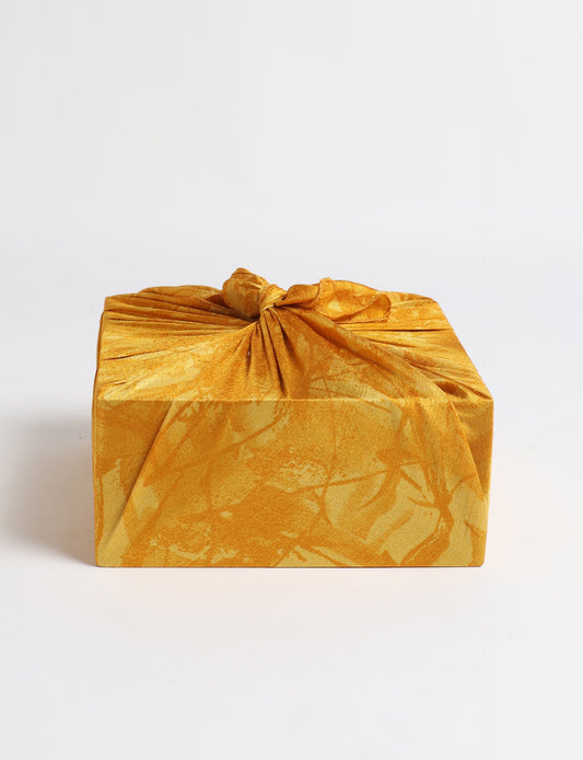 A delicately handcrafted wrap made from recycled sari offcuts, blending sustainable fashion with conscious design. This eco-friendly product showcases the beauty of upcycling and green fashion, making it a perfect accessory for those supporting circular fashion and products made from textile waste.