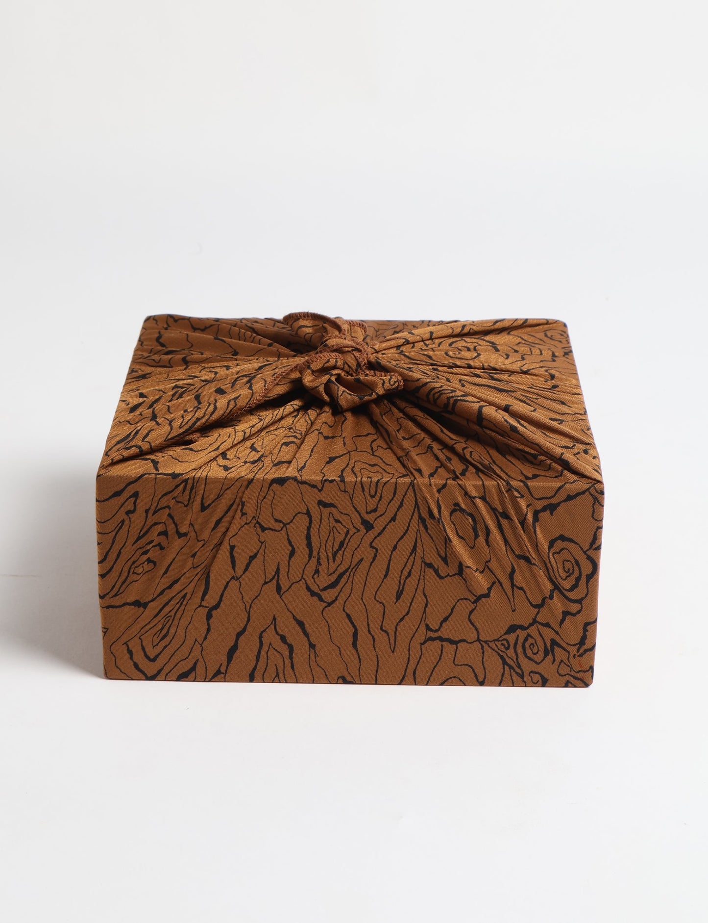 A delicately handcrafted wrap made from recycled sari offcuts, blending sustainable fashion with conscious design. This eco-friendly product showcases the beauty of upcycling and green fashion, making it a perfect accessory for those supporting circular fashion and products made from textile waste.