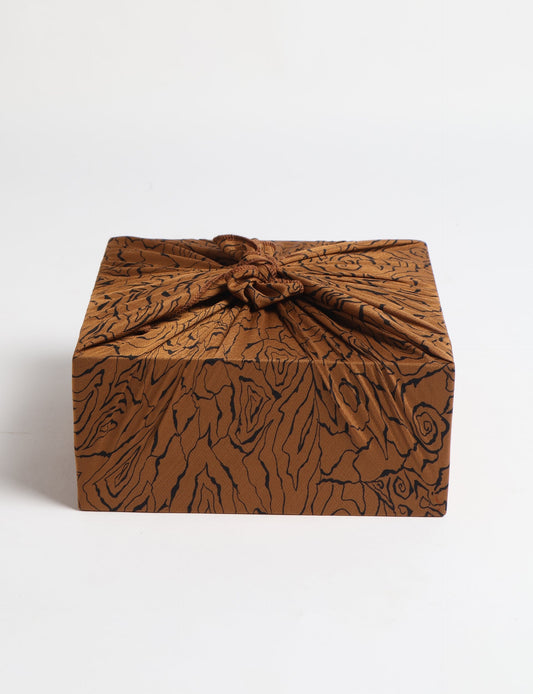 A delicately handcrafted wrap made from recycled sari offcuts, blending sustainable fashion with conscious design. This eco-friendly product showcases the beauty of upcycling and green fashion, making it a perfect accessory for those supporting circular fashion and products made from textile waste.