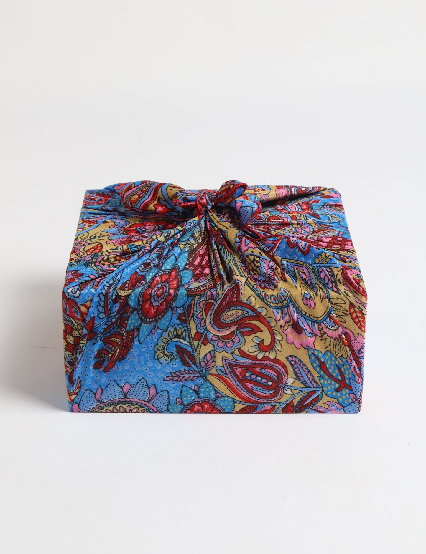 A delicately handcrafted wrap made from recycled sari offcuts, blending sustainable fashion with conscious design. This eco-friendly product showcases the beauty of upcycling and green fashion, making it a perfect accessory for those supporting circular fashion and products made from textile waste.