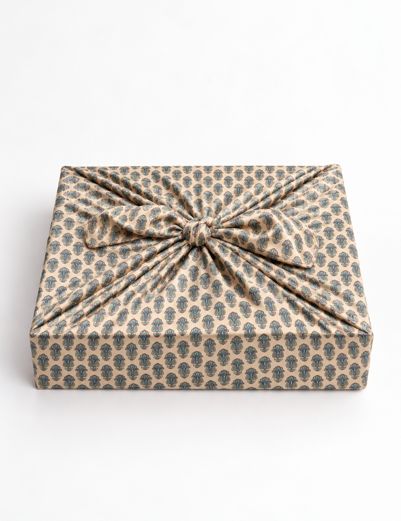 A delicately handcrafted wrap made from recycled sari offcuts, blending sustainable fashion with conscious design. This eco-friendly product showcases the beauty of upcycling and green fashion, making it a perfect accessory for those supporting circular fashion and products made from textile waste.