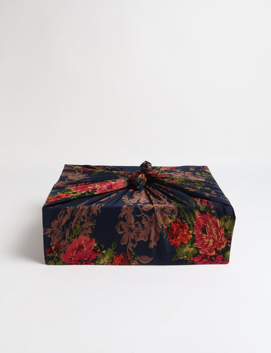 A delicately handcrafted wrap made from recycled sari offcuts, blending sustainable fashion with conscious design. This eco-friendly product showcases the beauty of upcycling and green fashion, making it a perfect accessory for those supporting circular fashion and products made from textile waste.