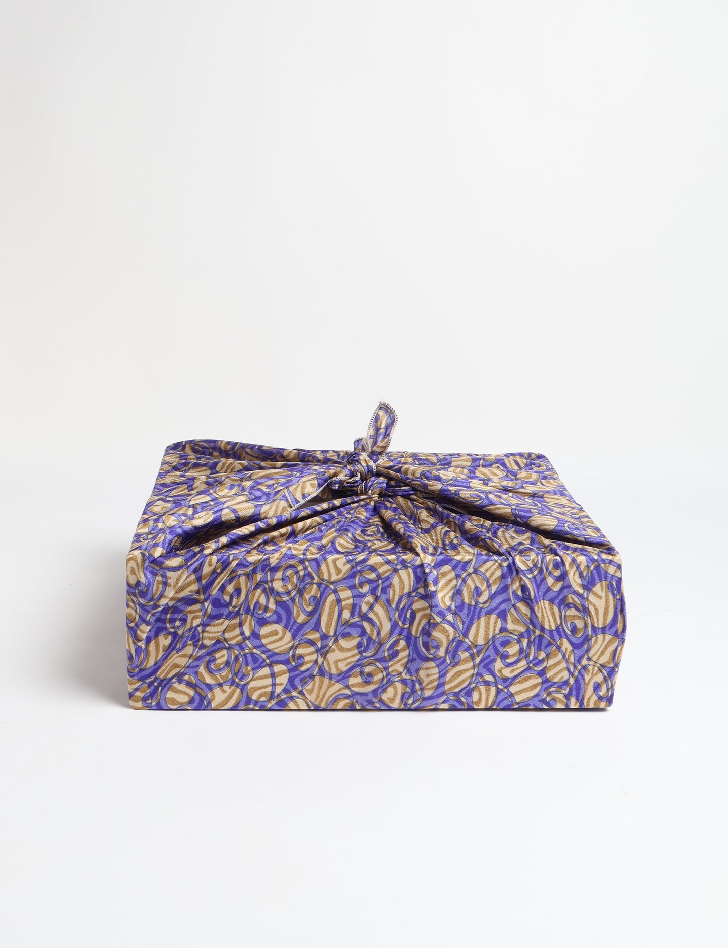 A delicately handcrafted wrap made from recycled sari offcuts, blending sustainable fashion with conscious design. This eco-friendly product showcases the beauty of upcycling and green fashion, making it a perfect accessory for those supporting circular fashion and products made from textile waste.