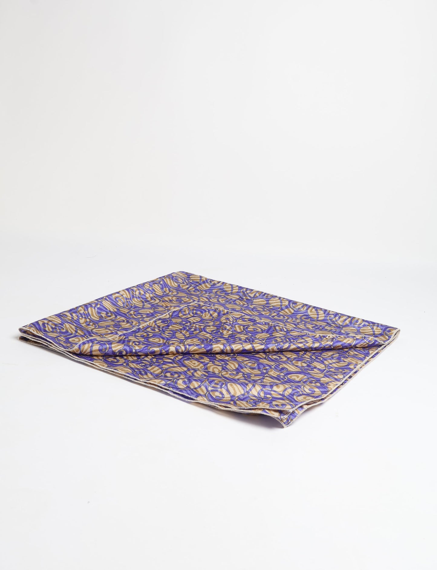 A delicately handcrafted wrap made from recycled sari offcuts, blending sustainable fashion with conscious design. This eco-friendly product showcases the beauty of upcycling and green fashion, making it a perfect accessory for those supporting circular fashion and products made from textile waste.