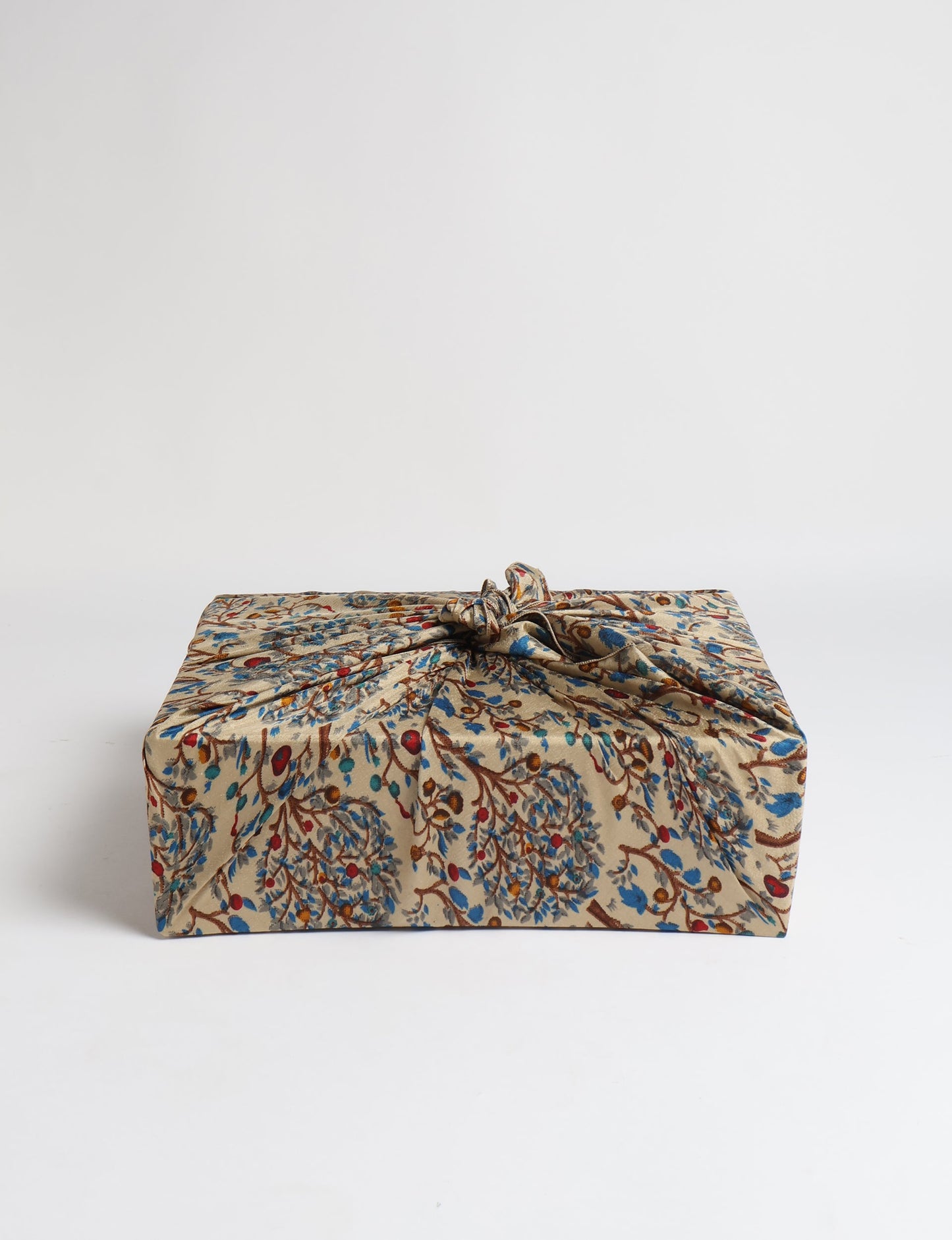 A delicately handcrafted wrap made from recycled sari offcuts, blending sustainable fashion with conscious design. This eco-friendly product showcases the beauty of upcycling and green fashion, making it a perfect accessory for those supporting circular fashion and products made from textile waste.