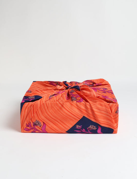 A delicately handcrafted wrap made from recycled sari offcuts, blending sustainable fashion with conscious design. This eco-friendly product showcases the beauty of upcycling and green fashion, making it a perfect accessory for those supporting circular fashion and products made from textile waste.