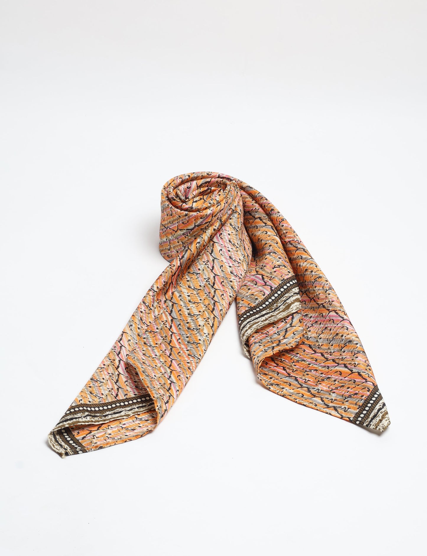 Chic and eco-friendly FOULARD square scarves, perfect for dressing up any outfit. Versatile styling around the head or neck for sunny days outdoors and evenings indoors, in warm and cooler climes. Ethical, eco-friendly, and stylish accessories to elevate your sustainable fashion game.