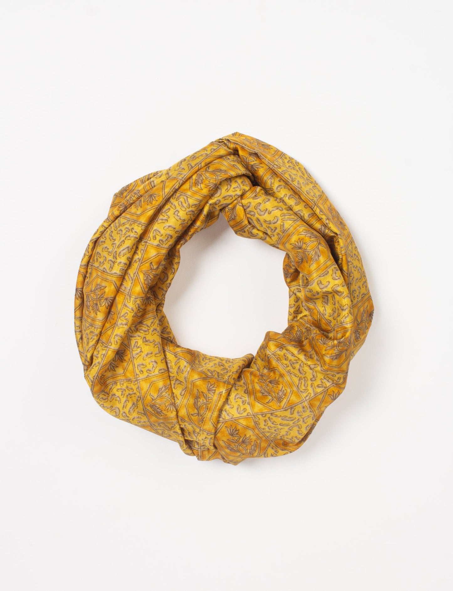 Sustainable style embraces you with our LOOP SCARF – an infinity-style scarf crafted from vibrant, pattern-rich saris. Handcrafted by experienced Mumbai-based artisans, this versatile scarf can be worn looped once or twice around your neck or as a head-wrap. From laid-back beach vacations to dress-to-impress dinners, this scarf is a timeless accessory.