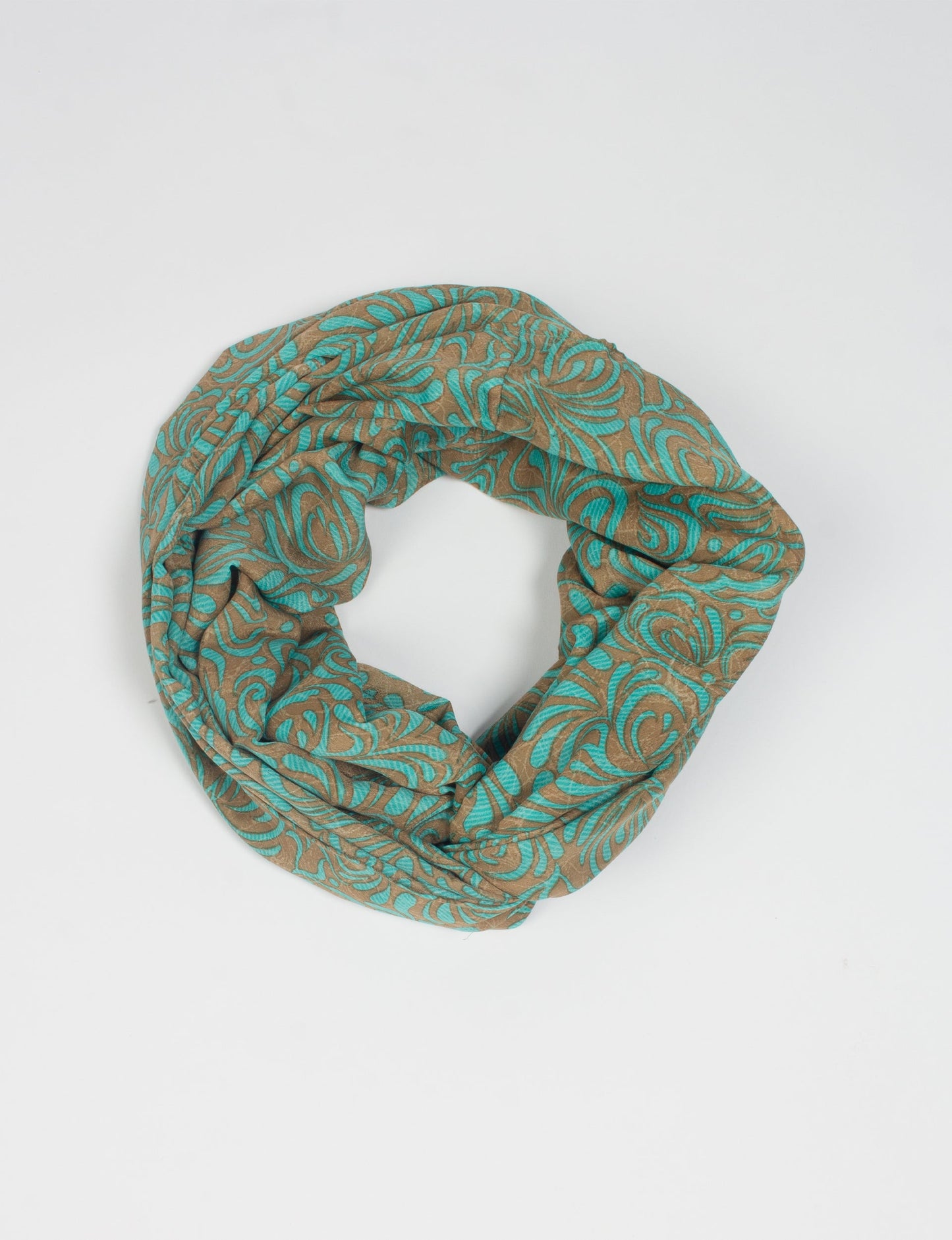 Sustainable style embraces you with our LOOP SCARF – an infinity-style scarf crafted from vibrant, pattern-rich saris. Handcrafted by experienced Mumbai-based artisans, this versatile scarf can be worn looped once or twice around your neck or as a head-wrap. From laid-back beach vacations to dress-to-impress dinners, this scarf is a timeless accessory.