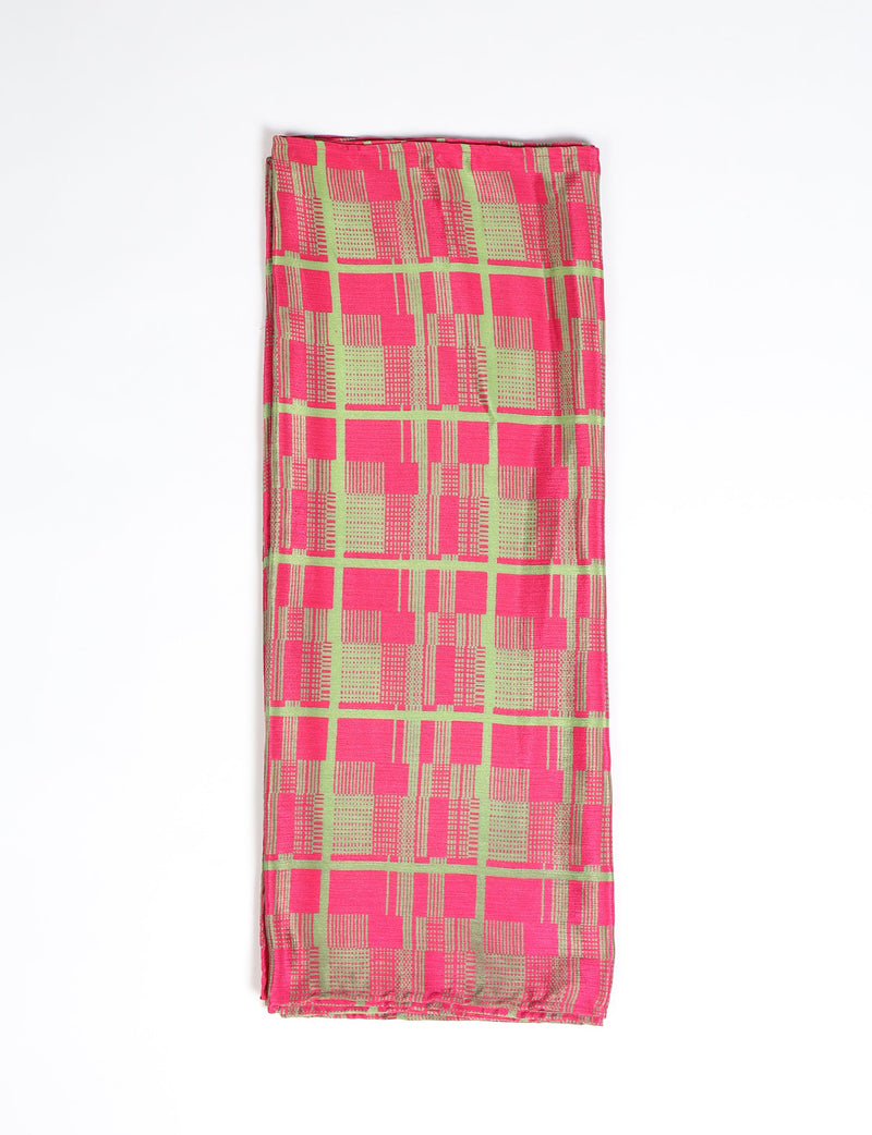 Folded pink stole with an abstract green and gold checkered pattern, flat lay on white background