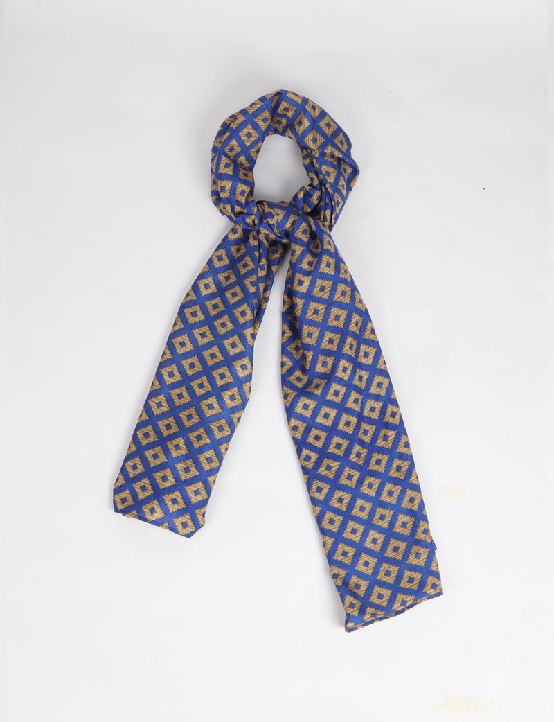 Blue stole with gold geometric diamond pattern, shown knotted against a white background