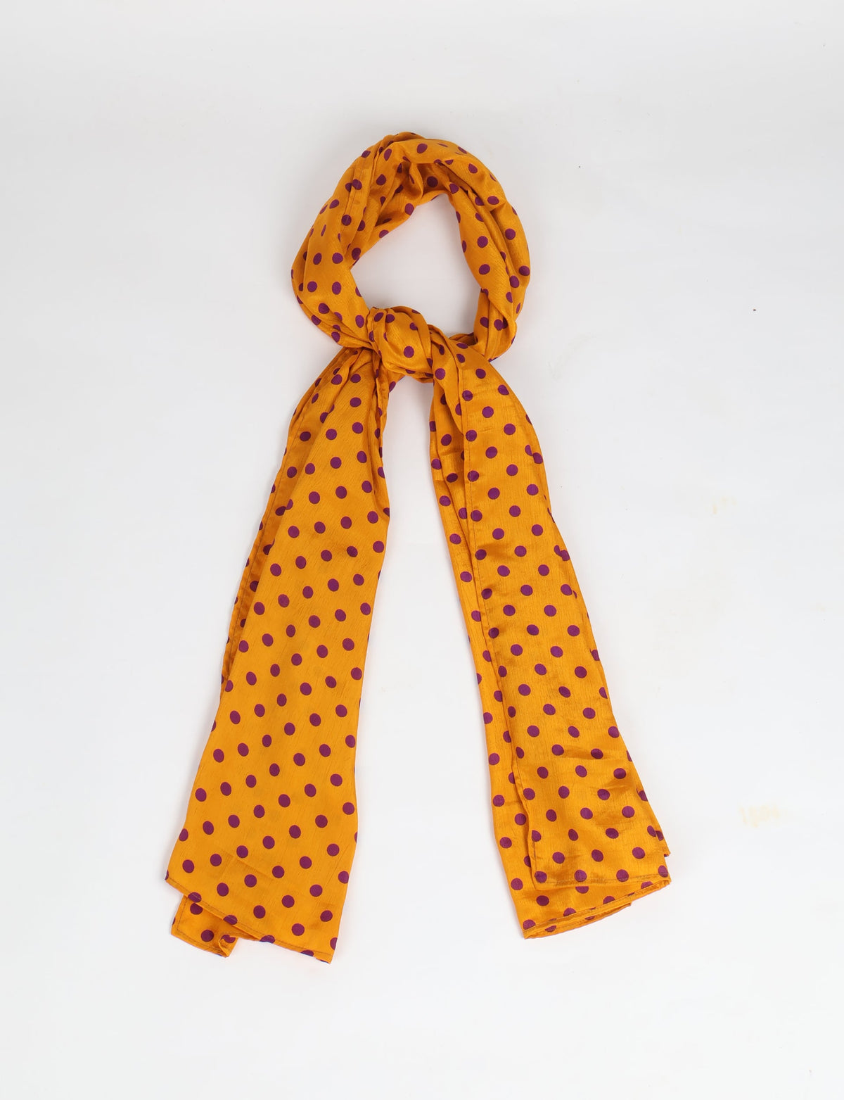 Yellow stole with purple polka dot micro design, shown knotted on a white background, lightweight fabric texture visible