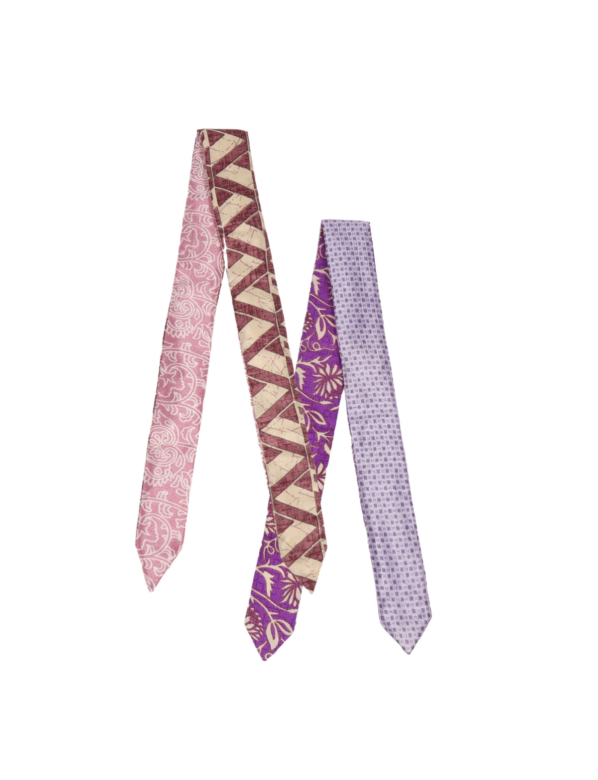 Set of two assorted patterned fabric headbands in pink, purple, and beige tones, flat laid on white background