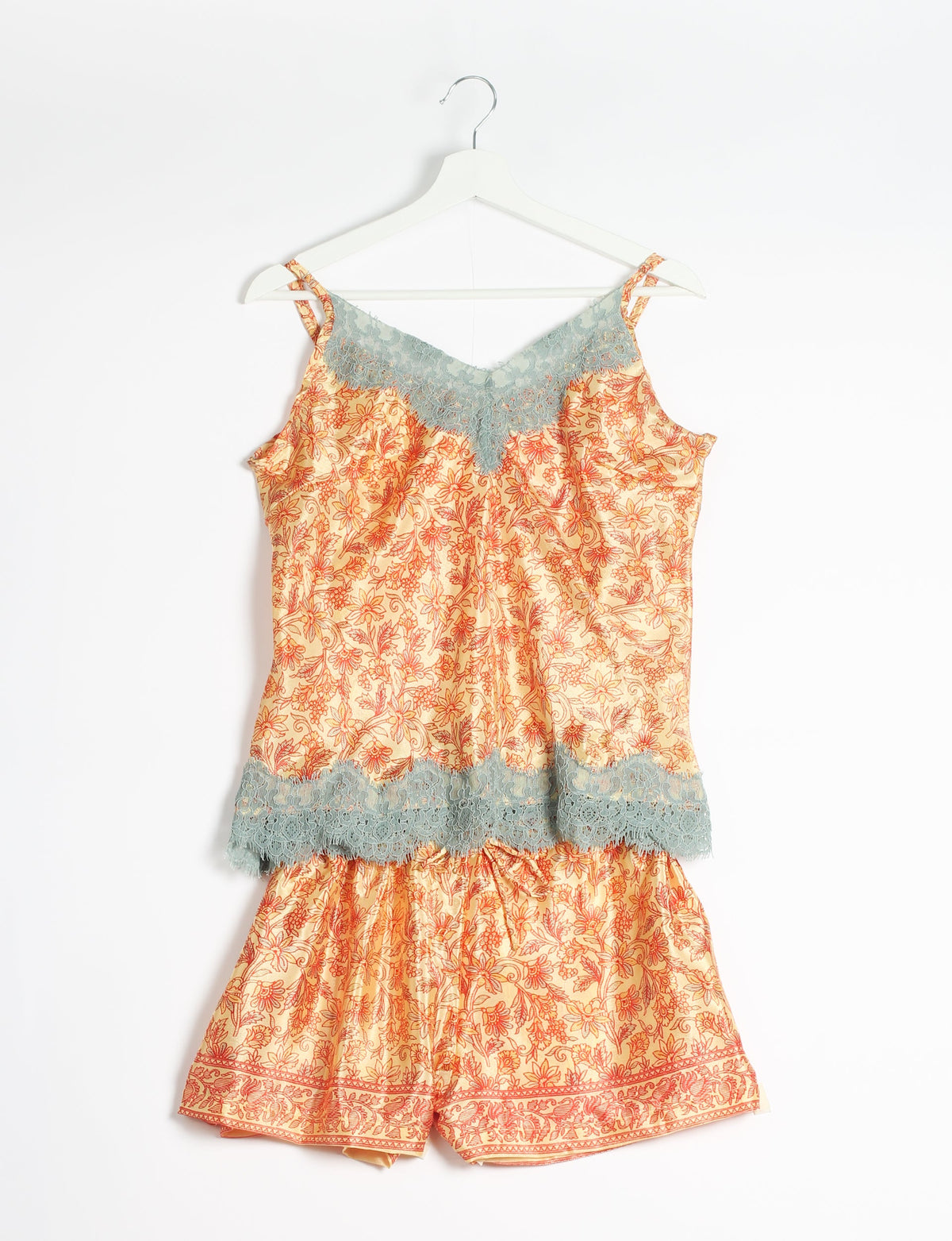 Sleep in eco-friendly luxury with our PJ Set Short. Made for the conscious consumer, these pajamas contribute to zero waste and sustainable practices. The cami top, adorned with delicate eyelash lace and cut on the bias, pairs seamlessly with the comfy shorts featuring an elasticated waist and drawstring tie.