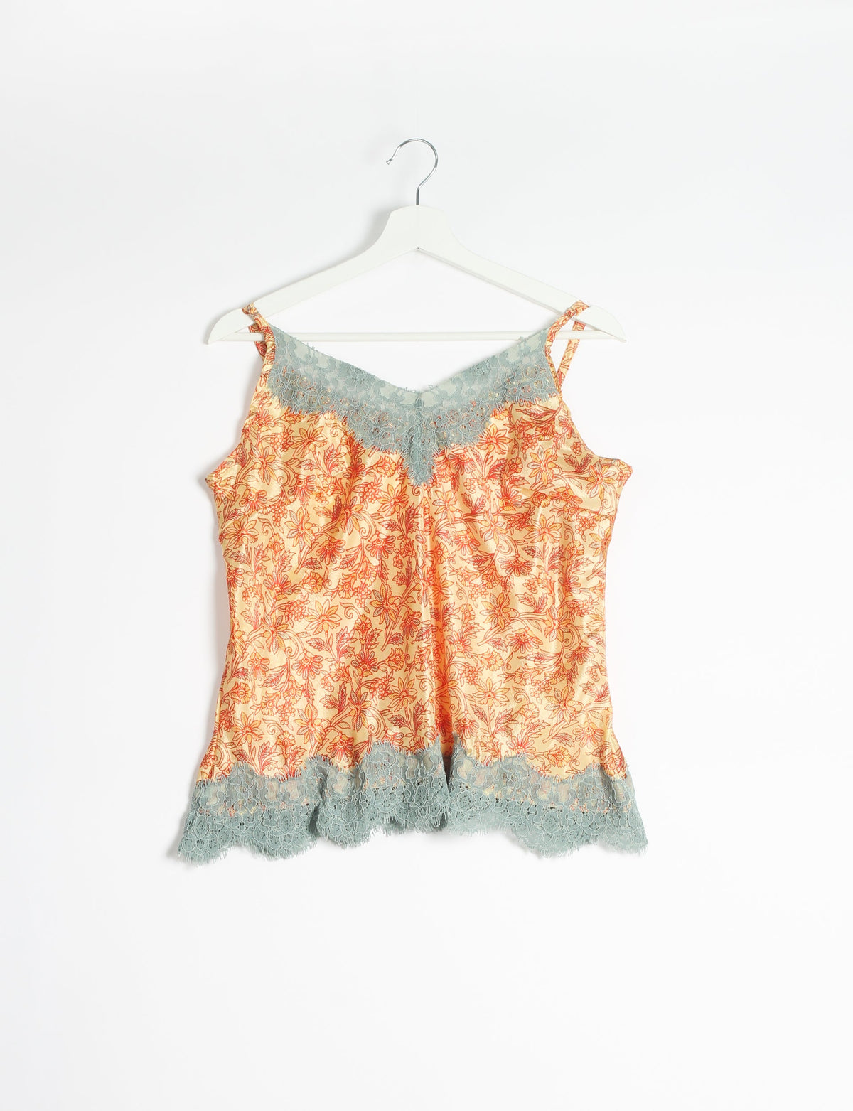 Sleep in eco-friendly luxury with our PJ Set Short. Made for the conscious consumer, these pajamas contribute to zero waste and sustainable practices. The cami top, adorned with delicate eyelash lace and cut on the bias, pairs seamlessly with the comfy shorts featuring an elasticated waist and drawstring tie.