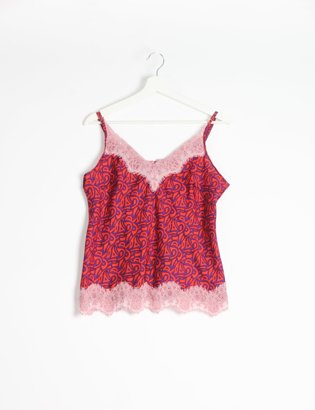 Sleep in eco-friendly luxury with our PJ Set Short. Made for the conscious consumer, these pajamas contribute to zero waste and sustainable practices. The cami top, adorned with delicate eyelash lace and cut on the bias, pairs seamlessly with the comfy shorts featuring an elasticated waist and drawstring tie.