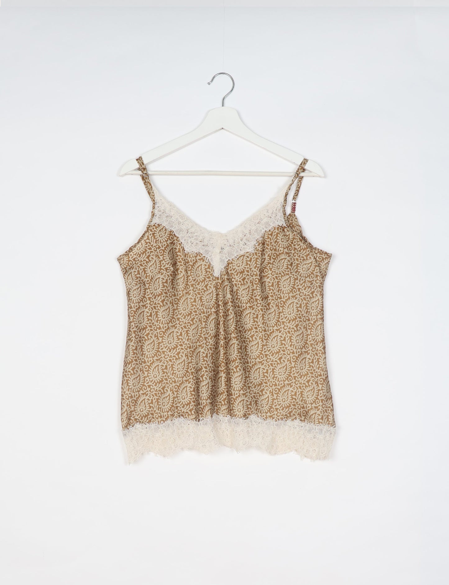 Sleep in eco-friendly luxury with our PJ Set Short. Made for the conscious consumer, these pajamas contribute to zero waste and sustainable practices. The cami top, adorned with delicate eyelash lace and cut on the bias, pairs seamlessly with the comfy shorts featuring an elasticated waist and drawstring tie.