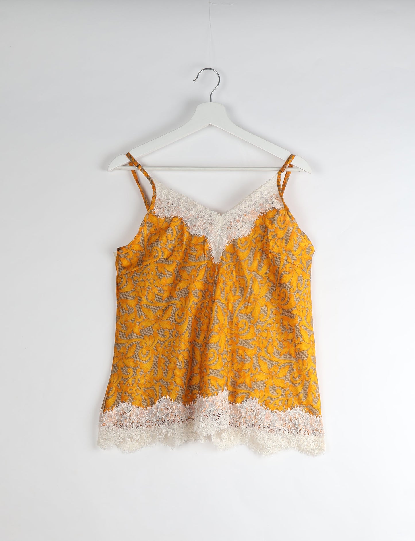 Sleep in eco-friendly luxury with our PJ Set Short. Made for the conscious consumer, these pajamas contribute to zero waste and sustainable practices. The cami top, adorned with delicate eyelash lace and cut on the bias, pairs seamlessly with the comfy shorts featuring an elasticated waist and drawstring tie.