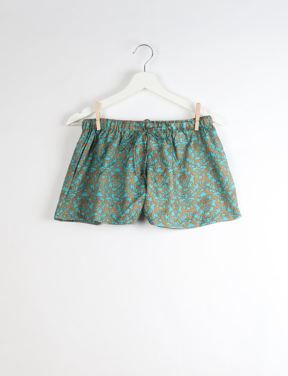 Sleep in eco-friendly luxury with our PJ Set Short. Made for the conscious consumer, these pajamas contribute to zero waste and sustainable practices. The cami top, adorned with delicate eyelash lace and cut on the bias, pairs seamlessly with the comfy shorts featuring an elasticated waist and drawstring tie.