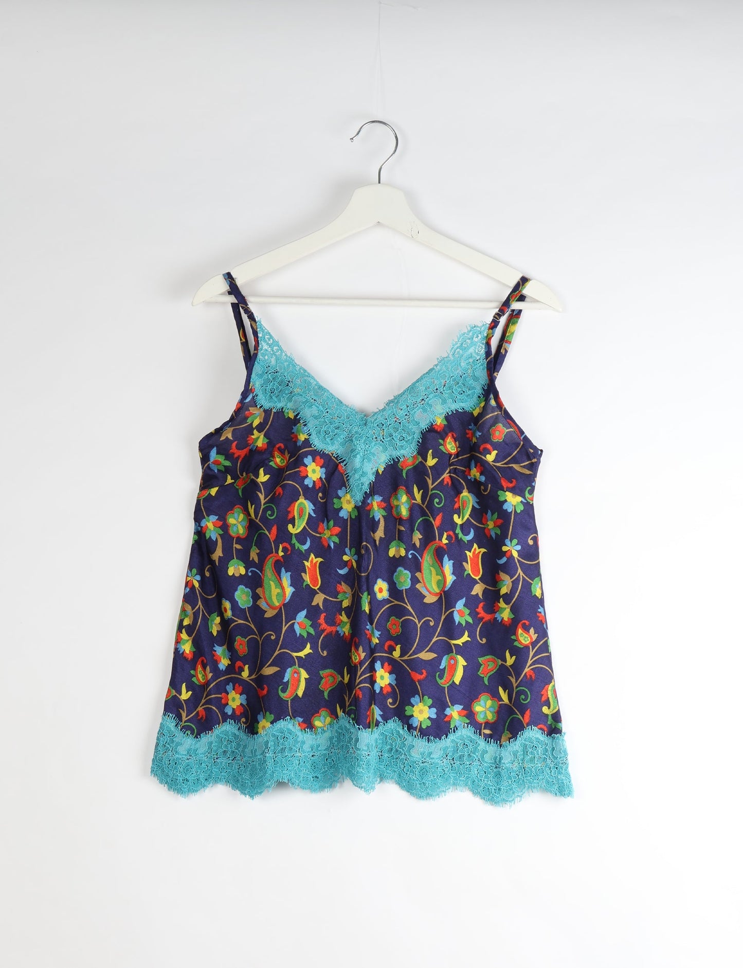 Sleep in eco-friendly luxury with our PJ Set Short. Made for the conscious consumer, these pajamas contribute to zero waste and sustainable practices. The cami top, adorned with delicate eyelash lace and cut on the bias, pairs seamlessly with the comfy shorts featuring an elasticated waist and drawstring tie.