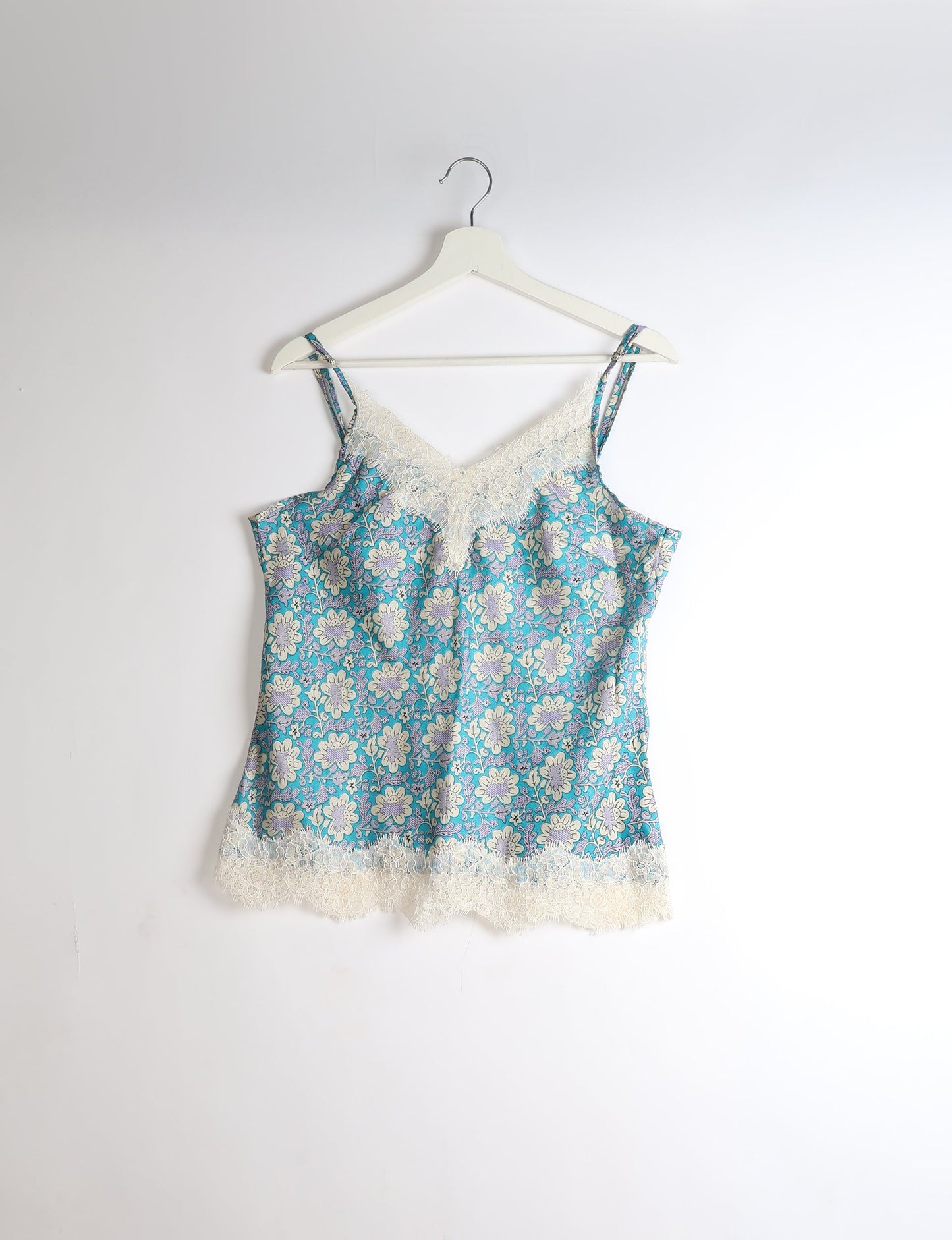 Sleep in eco-friendly luxury with our PJ Set Short. Made for the conscious consumer, these pajamas contribute to zero waste and sustainable practices. The cami top, adorned with delicate eyelash lace and cut on the bias, pairs seamlessly with the comfy shorts featuring an elasticated waist and drawstring tie.