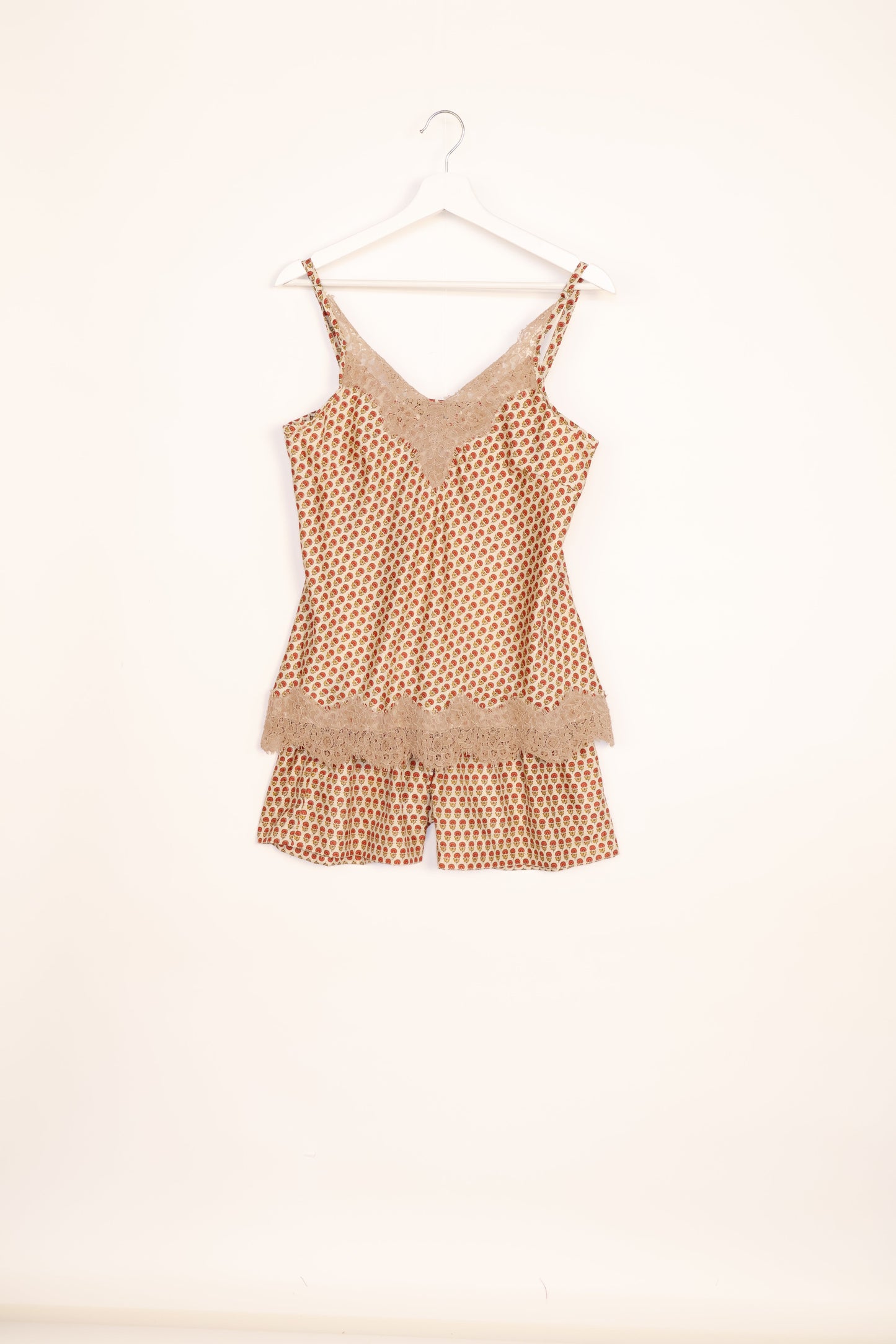 Sleep in eco-friendly luxury with our PJ Set Short. Made for the conscious consumer, these pajamas contribute to zero waste and sustainable practices. The cami top, adorned with delicate eyelash lace and cut on the bias, pairs seamlessly with the comfy shorts featuring an elasticated waist and drawstring tie.