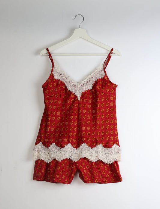 Sleep in eco-friendly luxury with our PJ Set Short. Made for the conscious consumer, these pajamas contribute to zero waste and sustainable practices. The cami top, adorned with delicate eyelash lace and cut on the bias, pairs seamlessly with the comfy shorts featuring an elasticated waist and drawstring tie.