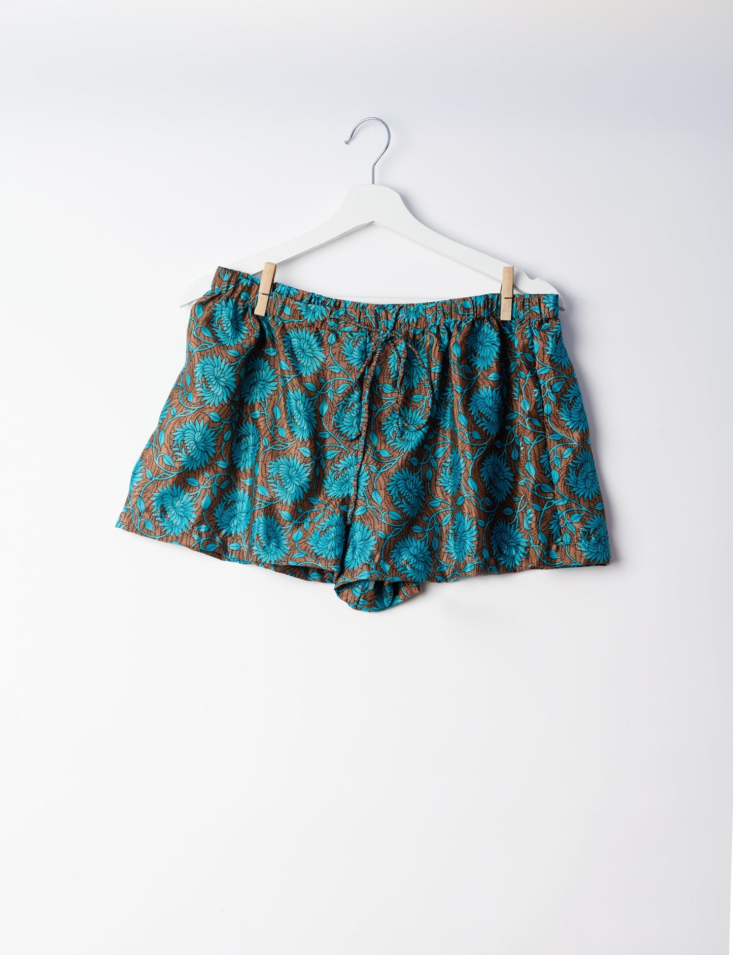 Sleep in eco-friendly luxury with our PJ Set Short. Made for the conscious consumer, these pajamas contribute to zero waste and sustainable practices. The cami top, adorned with delicate eyelash lace and cut on the bias, pairs seamlessly with the comfy shorts featuring an elasticated waist and drawstring tie.