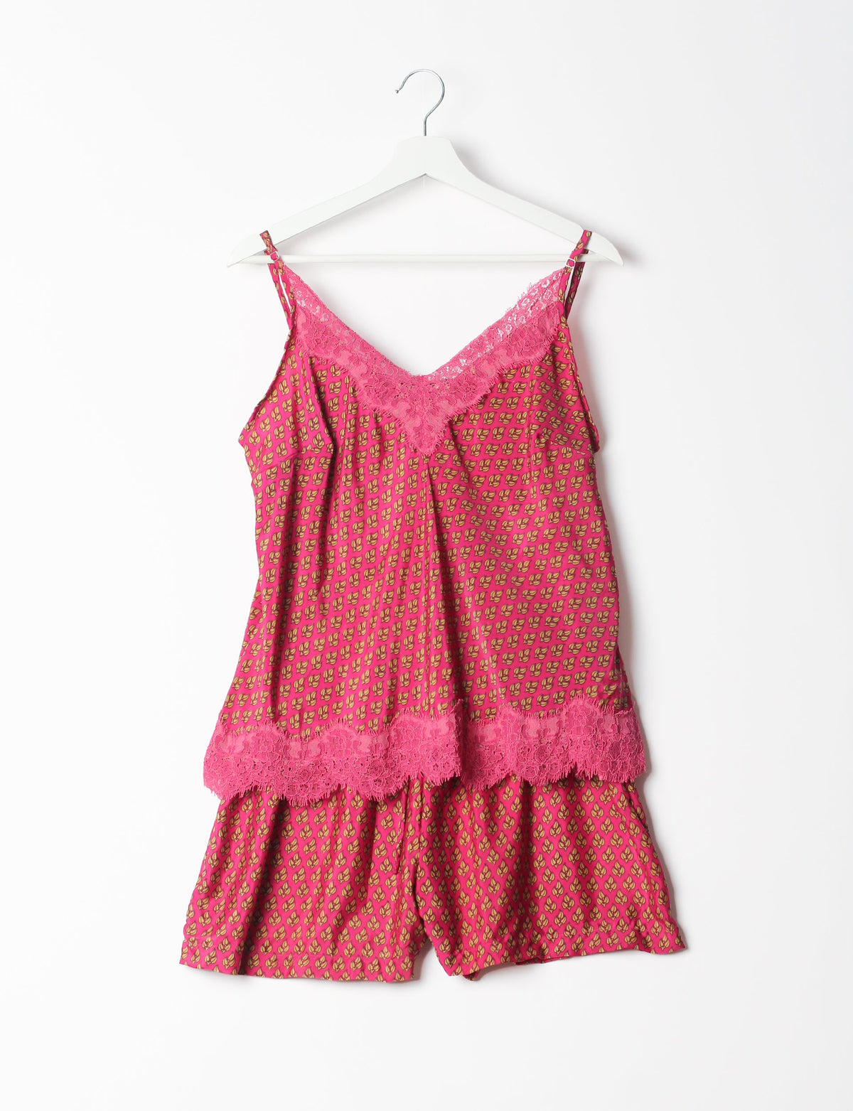 Sleep in eco-friendly luxury with our PJ Set Short. Made for the conscious consumer, these pajamas contribute to zero waste and sustainable practices. The cami top, adorned with delicate eyelash lace and cut on the bias, pairs seamlessly with the comfy shorts featuring an elasticated waist and drawstring tie.