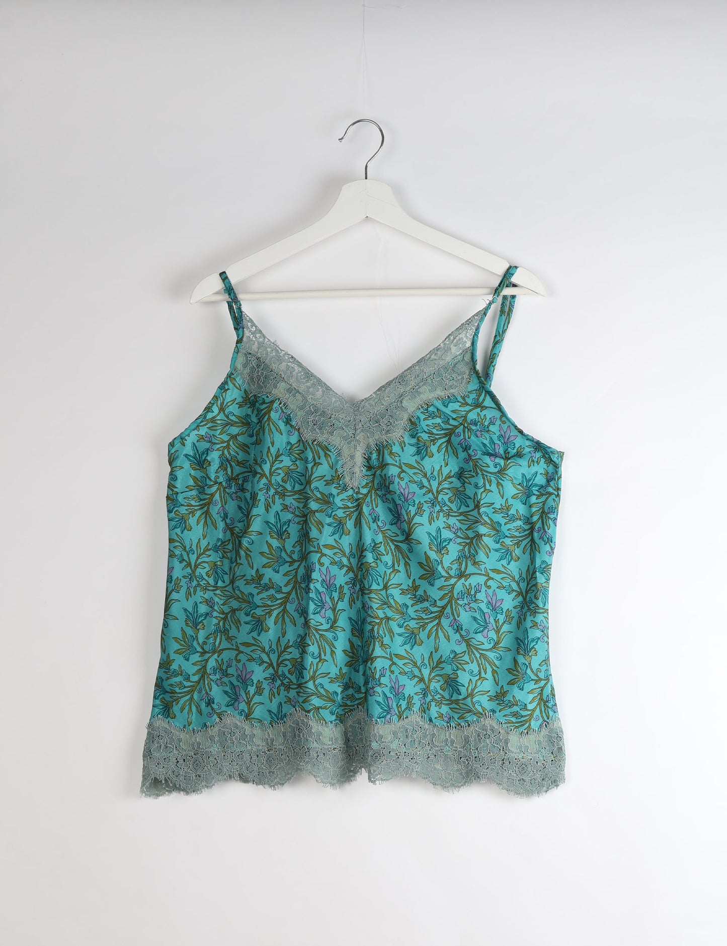 Sleep in eco-friendly luxury with our PJ Set Short. Made for the conscious consumer, these pajamas contribute to zero waste and sustainable practices. The cami top, adorned with delicate eyelash lace and cut on the bias, pairs seamlessly with the comfy shorts featuring an elasticated waist and drawstring tie.