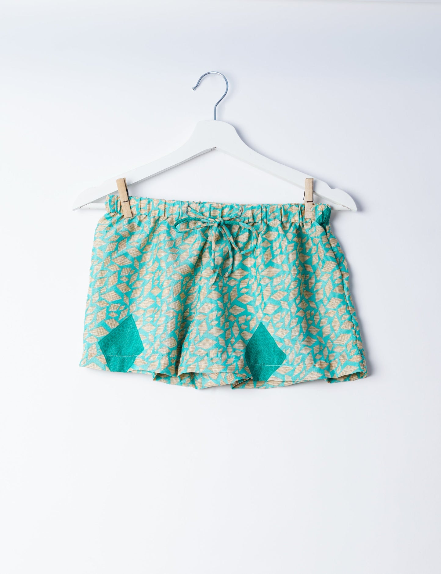 Sleep in eco-friendly luxury with our PJ Set Short. Made for the conscious consumer, these pajamas contribute to zero waste and sustainable practices. The cami top, adorned with delicate eyelash lace and cut on the bias, pairs seamlessly with the comfy shorts featuring an elasticated waist and drawstring tie.