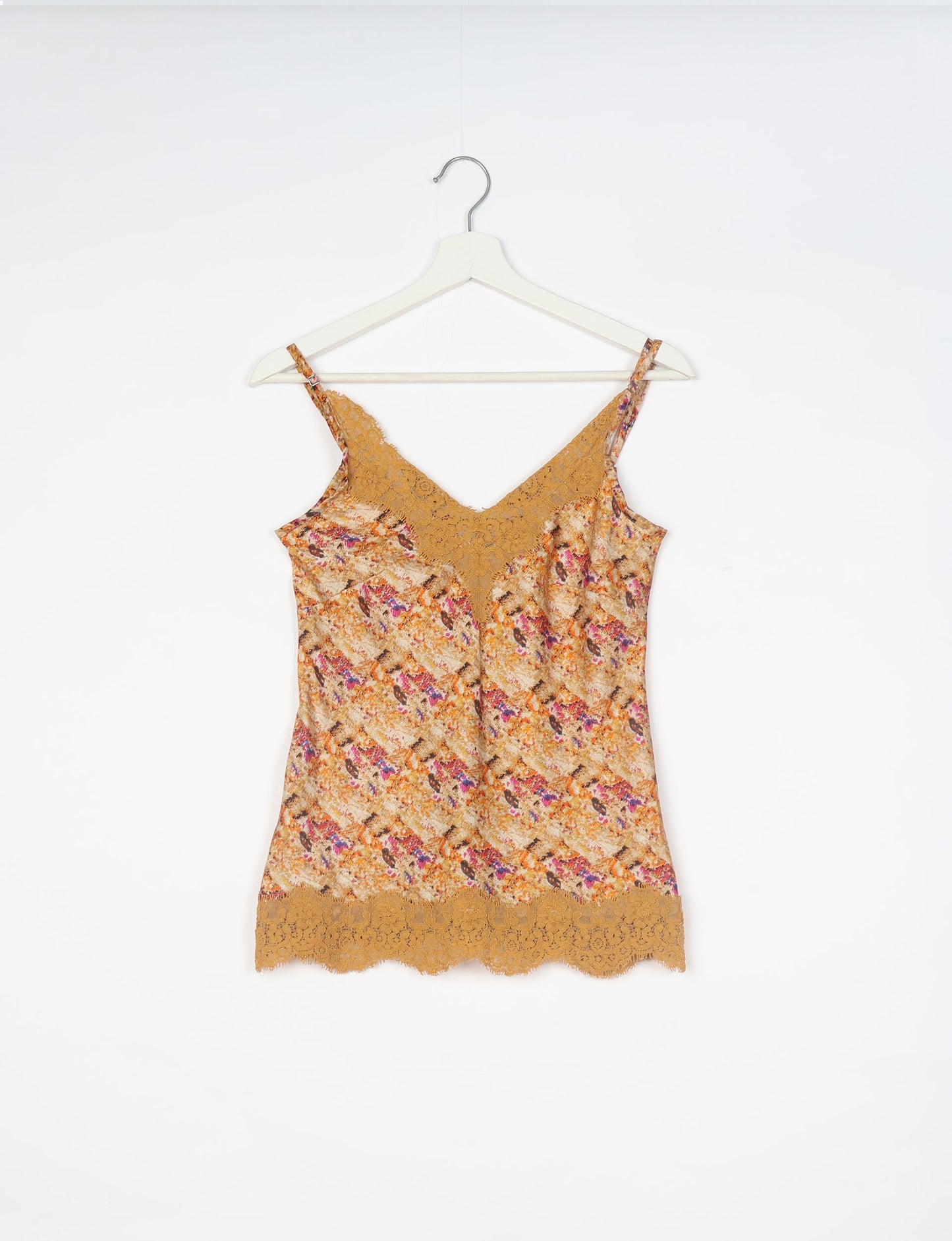 Sleep in eco-friendly luxury with our PJ Set Short. Made for the conscious consumer, these pajamas contribute to zero waste and sustainable practices. The cami top, adorned with delicate eyelash lace and cut on the bias, pairs seamlessly with the comfy shorts featuring an elasticated waist and drawstring tie.