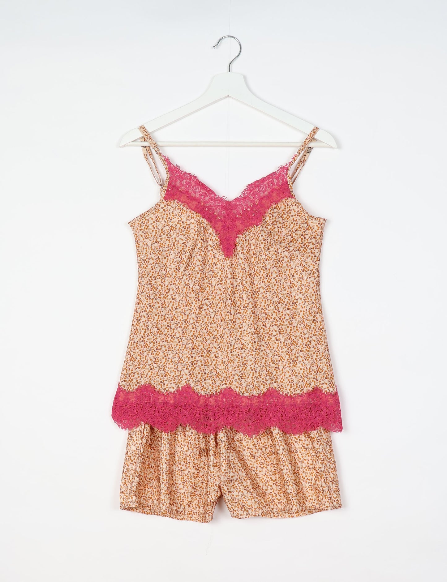 Sleep in eco-friendly luxury with our PJ Set Short. Made for the conscious consumer, these pajamas contribute to zero waste and sustainable practices. The cami top, adorned with delicate eyelash lace and cut on the bias, pairs seamlessly with the comfy shorts featuring an elasticated waist and drawstring tie.