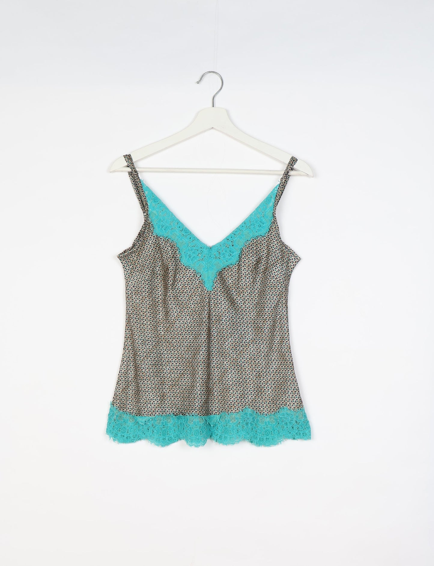 Sleep in eco-friendly luxury with our PJ Set Short. Made for the conscious consumer, these pajamas contribute to zero waste and sustainable practices. The cami top, adorned with delicate eyelash lace and cut on the bias, pairs seamlessly with the comfy shorts featuring an elasticated waist and drawstring tie.