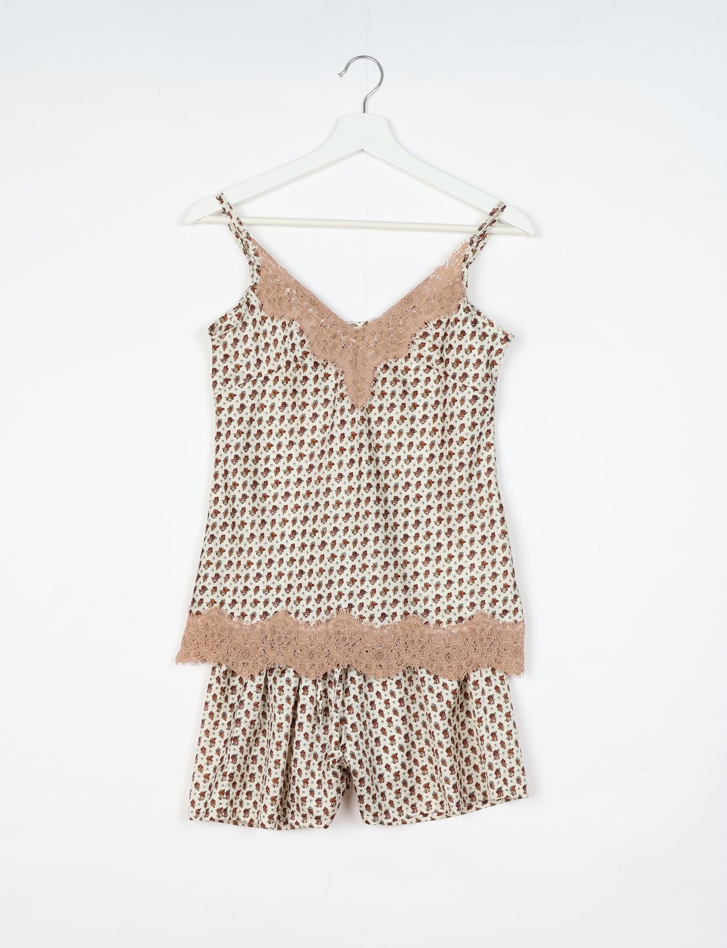 Sleep in eco-friendly luxury with our PJ Set Short. Made for the conscious consumer, these pajamas contribute to zero waste and sustainable practices. The cami top, adorned with delicate eyelash lace and cut on the bias, pairs seamlessly with the comfy shorts featuring an elasticated waist and drawstring tie.