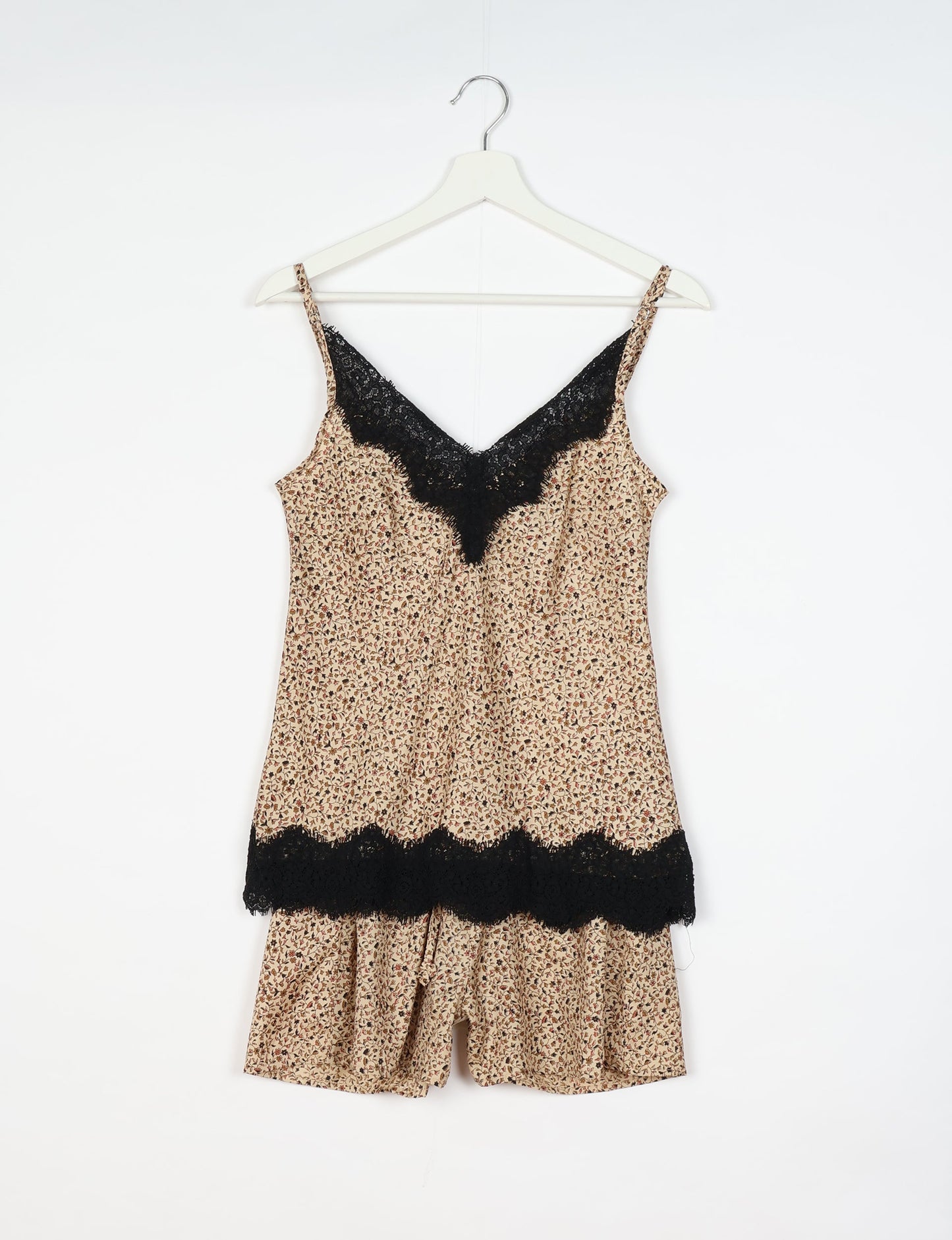 Sleep in eco-friendly luxury with our PJ Set Short. Made for the conscious consumer, these pajamas contribute to zero waste and sustainable practices. The cami top, adorned with delicate eyelash lace and cut on the bias, pairs seamlessly with the comfy shorts featuring an elasticated waist and drawstring tie.