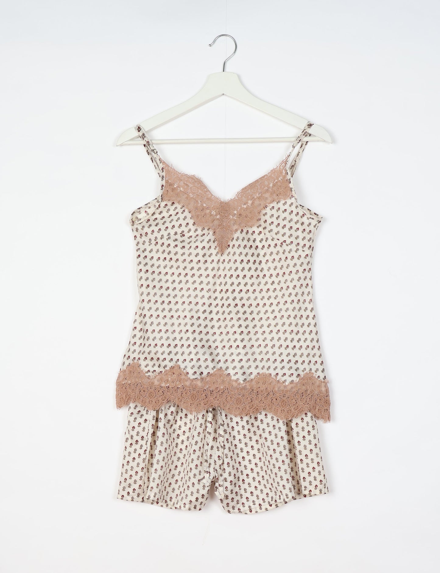 Sleep in eco-friendly luxury with our PJ Set Short. Made for the conscious consumer, these pajamas contribute to zero waste and sustainable practices. The cami top, adorned with delicate eyelash lace and cut on the bias, pairs seamlessly with the comfy shorts featuring an elasticated waist and drawstring tie.