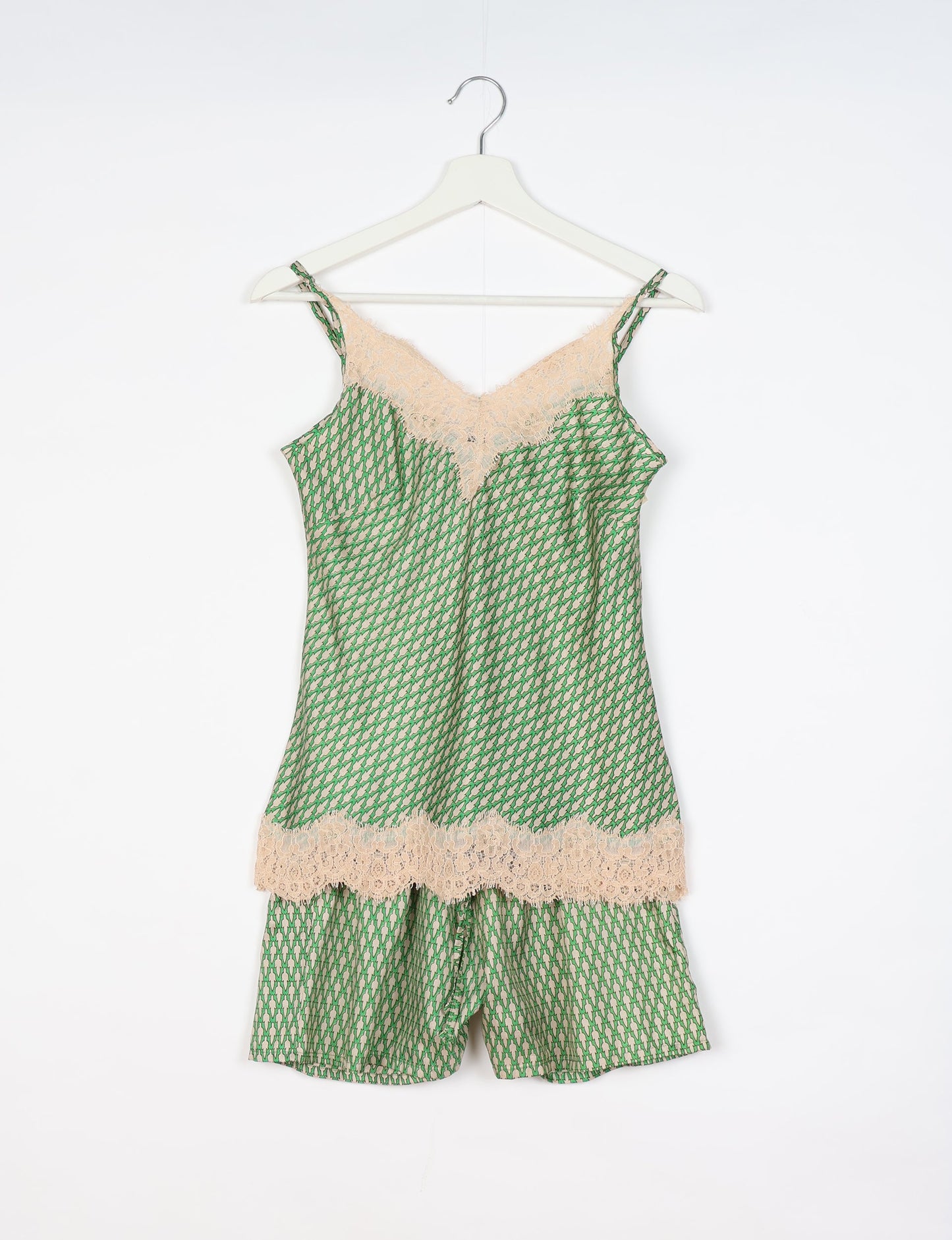 Sleep in eco-friendly luxury with our PJ Set Short. Made for the conscious consumer, these pajamas contribute to zero waste and sustainable practices. The cami top, adorned with delicate eyelash lace and cut on the bias, pairs seamlessly with the comfy shorts featuring an elasticated waist and drawstring tie.