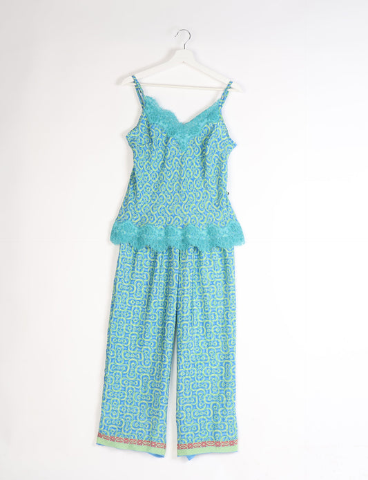 Discover the epitome of ethical sleepwear with our PJ Set Long – a blend of comfort, sustainability, and chic design. Crafted by skilled Mumbai artisans from upcycled saris, these pajamas redefine eco-friendly fashion, offering a conscious choice for your wardrobe.