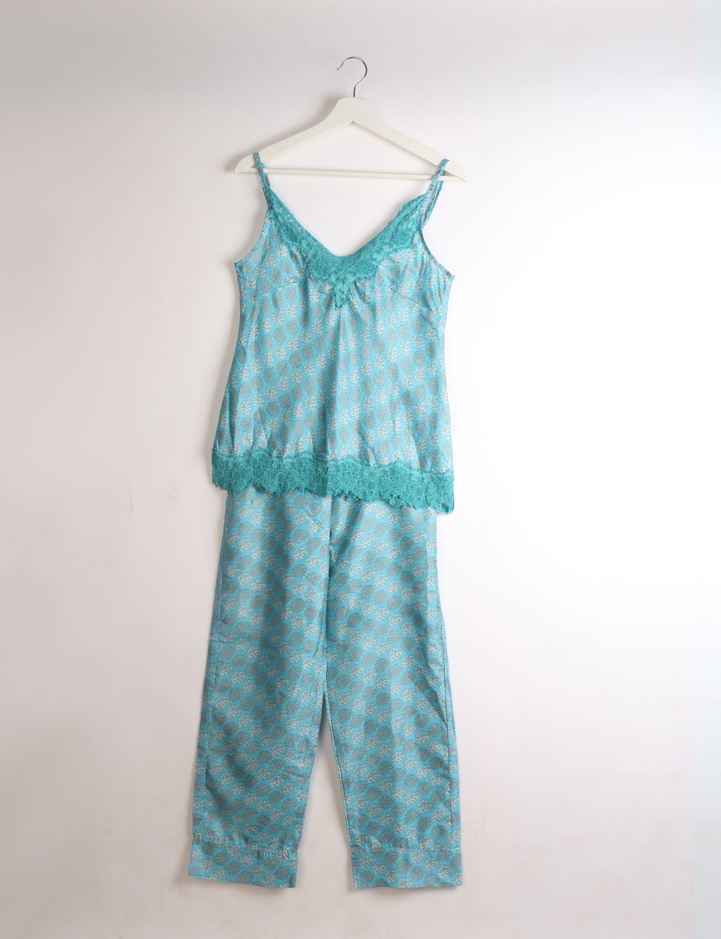 Discover the epitome of ethical sleepwear with our PJ Set Long – a blend of comfort, sustainability, and chic design. Crafted by skilled Mumbai artisans from upcycled saris, these pajamas redefine eco-friendly fashion, offering a conscious choice for your wardrobe.