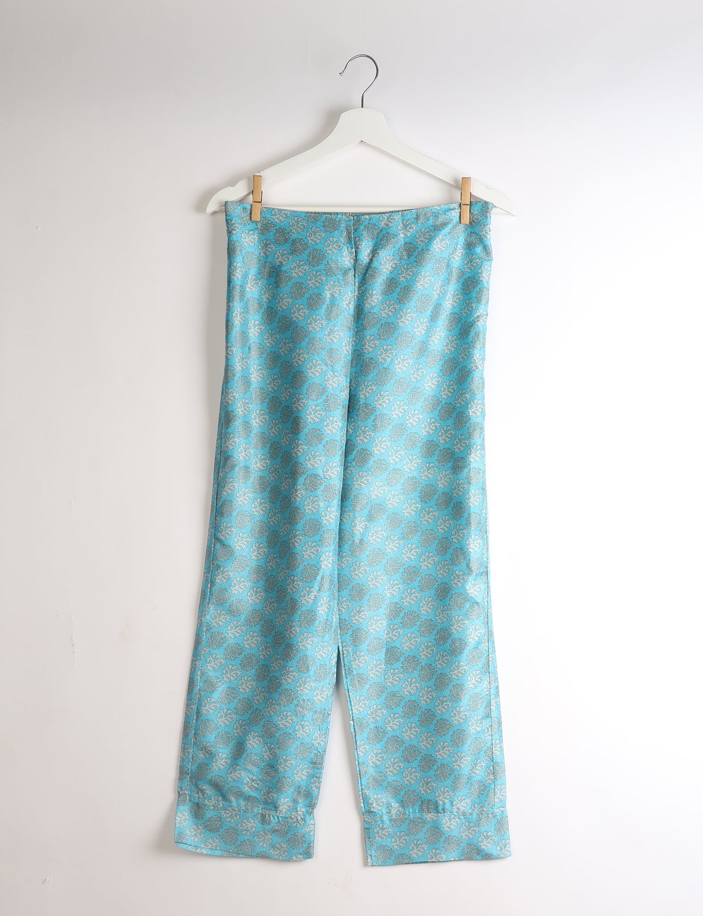 Discover the epitome of ethical sleepwear with our PJ Set Long – a blend of comfort, sustainability, and chic design. Crafted by skilled Mumbai artisans from upcycled saris, these pajamas redefine eco-friendly fashion, offering a conscious choice for your wardrobe.