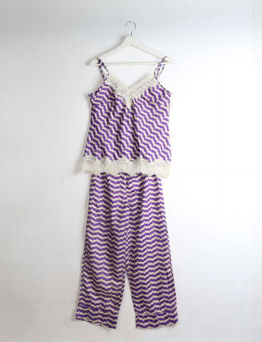 Discover the epitome of ethical sleepwear with our PJ Set Long – a blend of comfort, sustainability, and chic design. Crafted by skilled Mumbai artisans from upcycled saris, these pajamas redefine eco-friendly fashion, offering a conscious choice for your wardrobe.