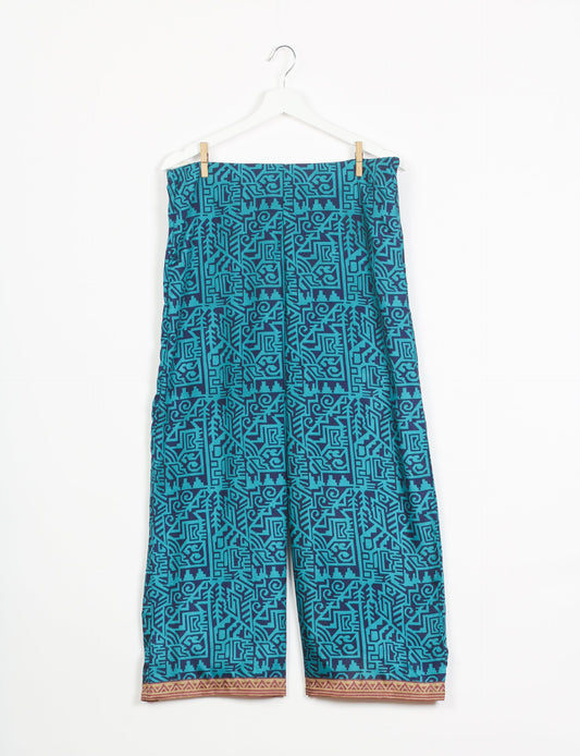 Step into sustainable fashion with our Palazzo Pants – a harmonious blend of Indian and Italian influences. These wide-legged pants, made from upcycled saris, offer comfort with an all-around elastic waist and a stylish flared leg. Make a statement with eco-friendly, chic palazzo pants that redefine ethical clothing.