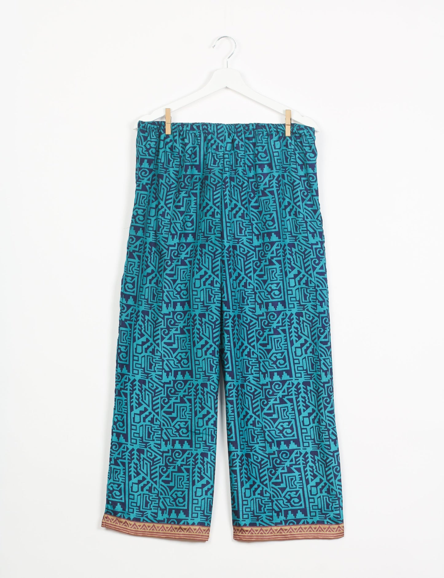 Step into sustainable fashion with our Palazzo Pants – a harmonious blend of Indian and Italian influences. These wide-legged pants, made from upcycled saris, offer comfort with an all-around elastic waist and a stylish flared leg. Make a statement with eco-friendly, chic palazzo pants that redefine ethical clothing.