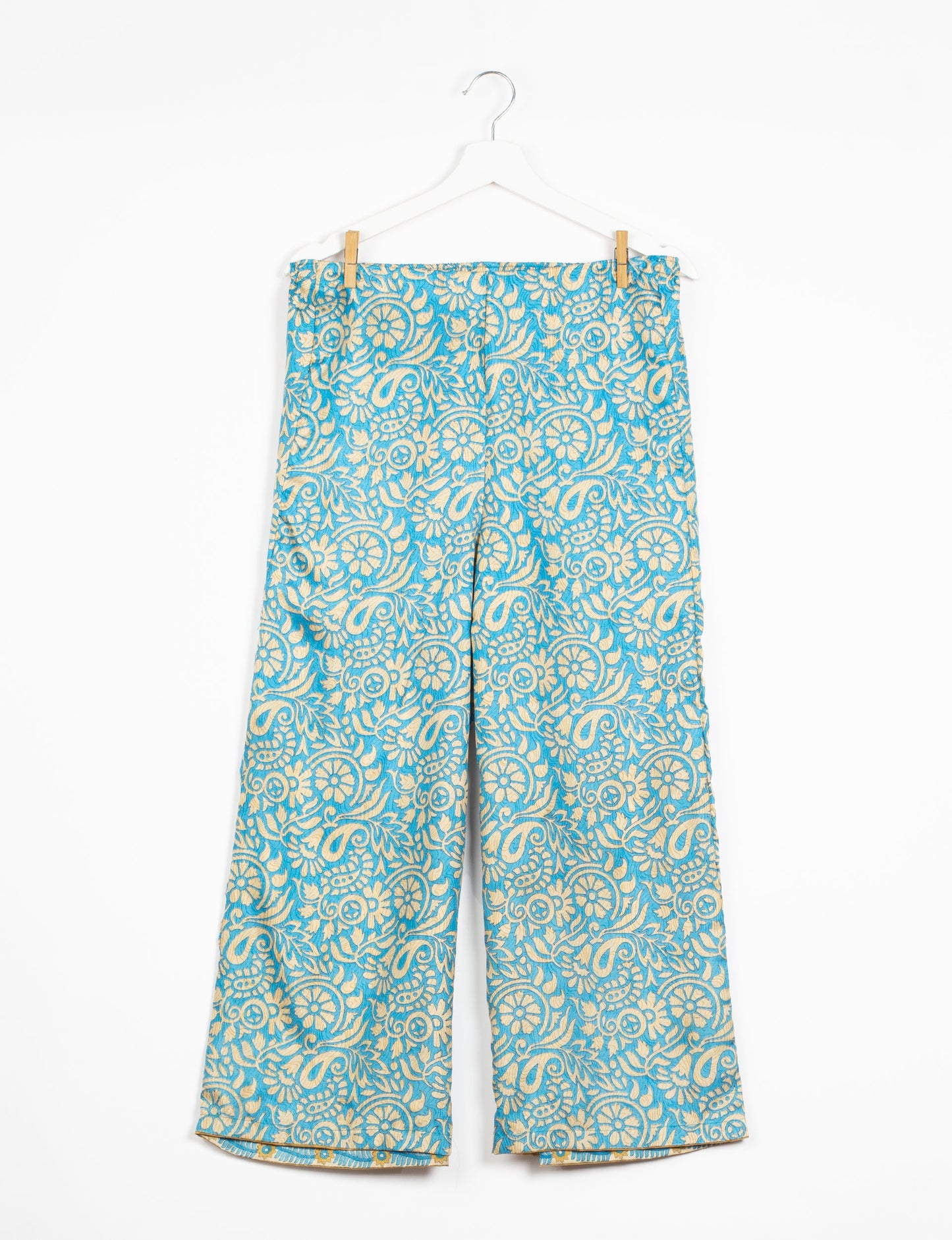 Step into sustainable fashion with our Palazzo Pants – a harmonious blend of Indian and Italian influences. These wide-legged pants, made from upcycled saris, offer comfort with an all-around elastic waist and a stylish flared leg. Make a statement with eco-friendly, chic palazzo pants that redefine ethical clothing.