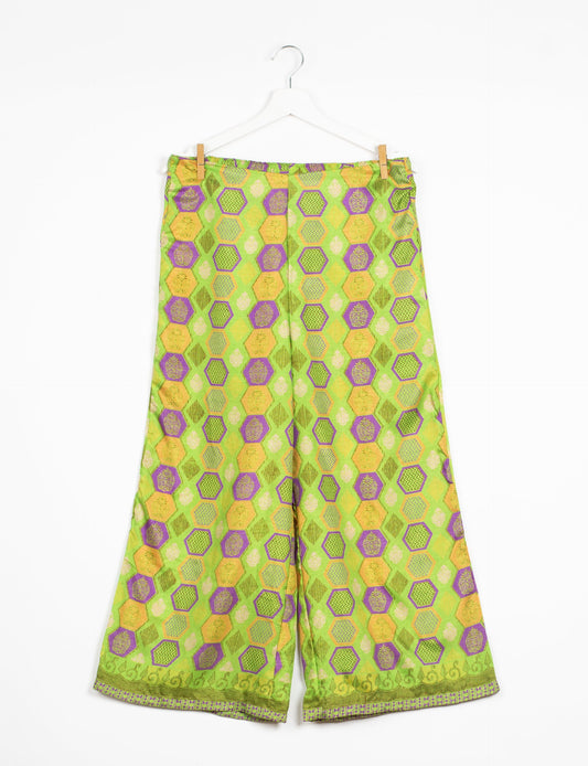 Step into sustainable fashion with our Palazzo Pants – a harmonious blend of Indian and Italian influences. These wide-legged pants, made from upcycled saris, offer comfort with an all-around elastic waist and a stylish flared leg. Make a statement with eco-friendly, chic palazzo pants that redefine ethical clothing.