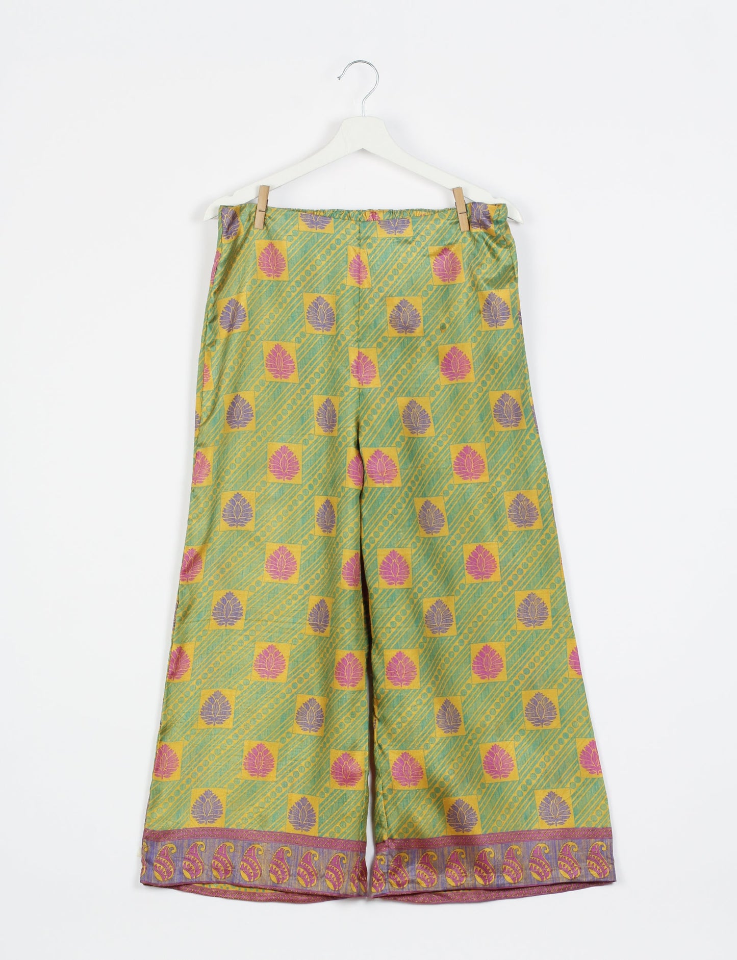 Step into sustainable fashion with our Palazzo Pants – a harmonious blend of Indian and Italian influences. These wide-legged pants, made from upcycled saris, offer comfort with an all-around elastic waist and a stylish flared leg. Make a statement with eco-friendly, chic palazzo pants that redefine ethical clothing.