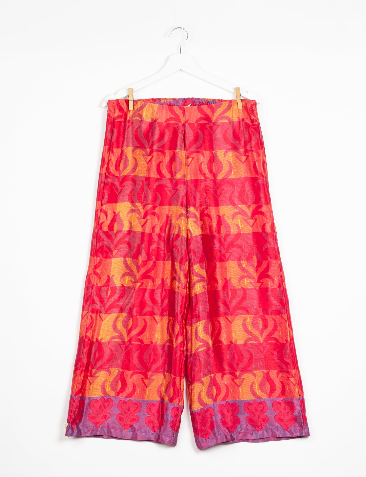 Step into sustainable fashion with our Palazzo Pants – a harmonious blend of Indian and Italian influences. These wide-legged pants, made from upcycled saris, offer comfort with an all-around elastic waist and a stylish flared leg. Make a statement with eco-friendly, chic palazzo pants that redefine ethical clothing.